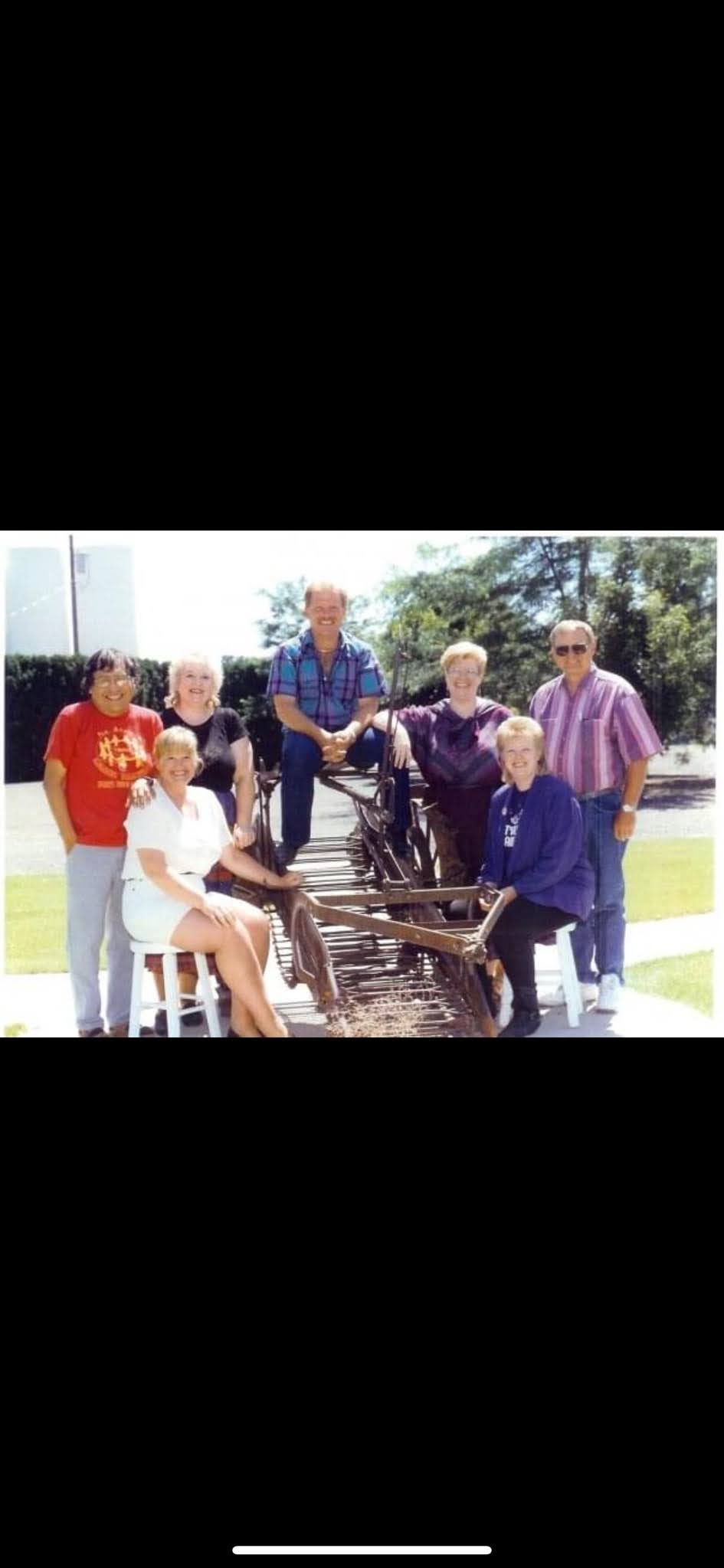 Barbara posing with family and some of her children.