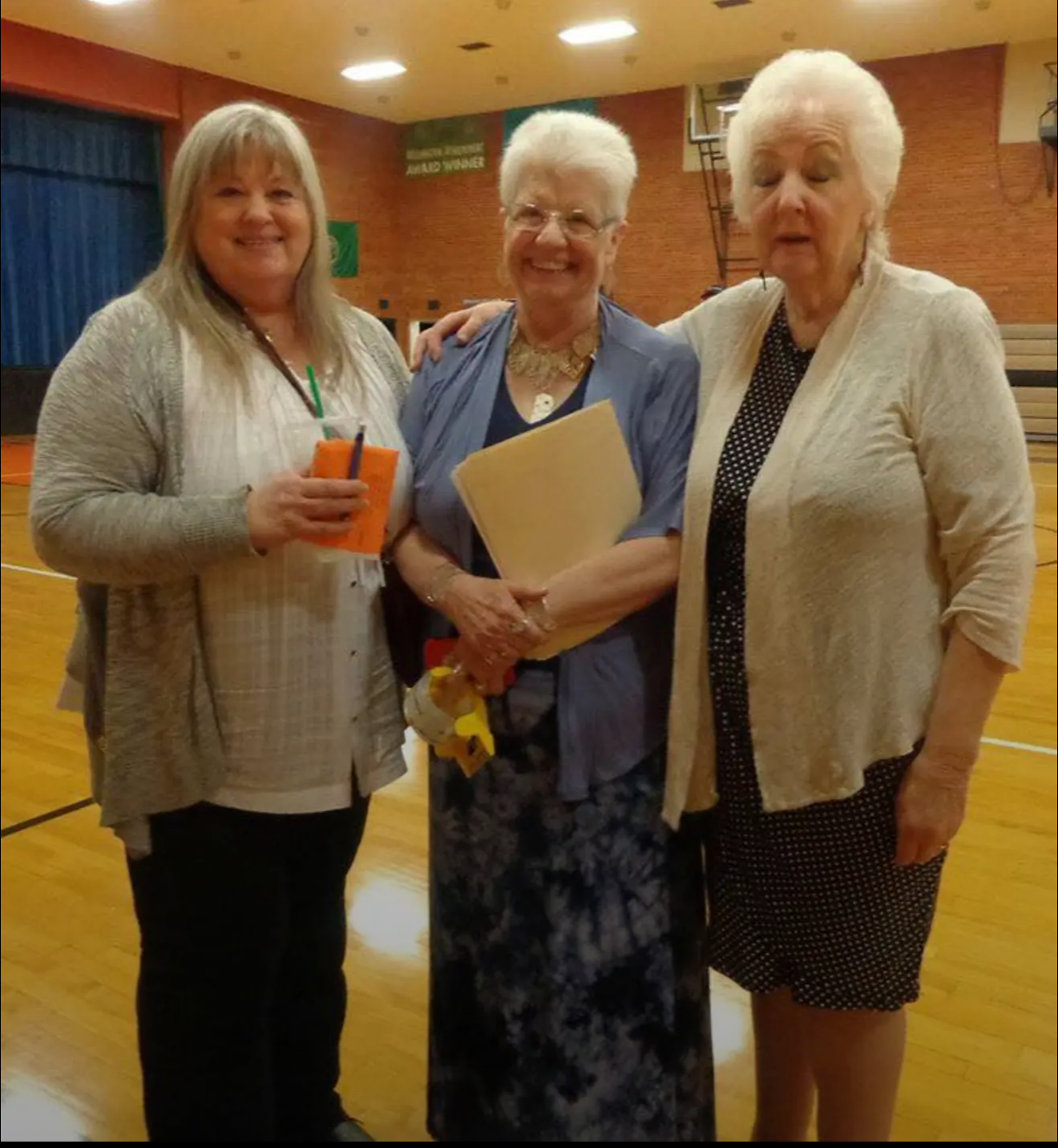 Barbara, Franny and Janice posing at an event.
